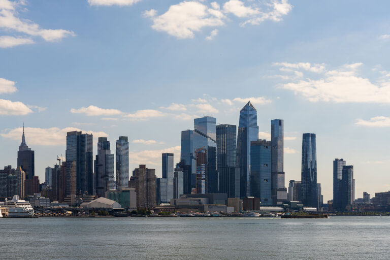 Manhattan skyline across Hudson River representing commercial real estate capital markets and investment activity